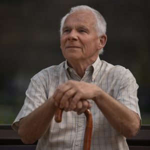 front-view-old-man-sitting-bench
